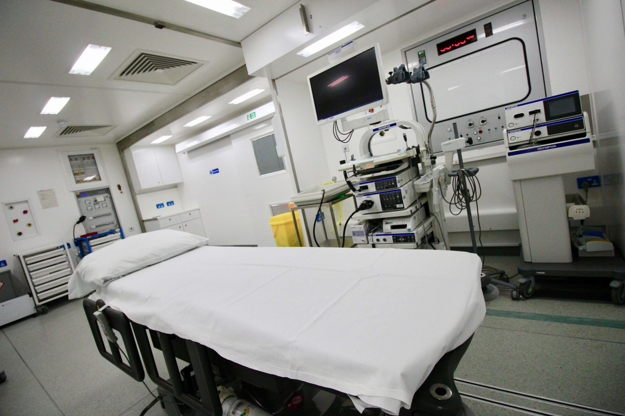 Endoscopy procedure room with an endoscopy system stack, monitor and prepared patient trolley